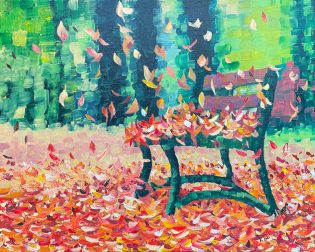 Falling colorful leaves on a bench